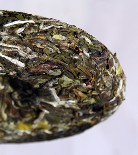 Tea For You Bai Mudan White tea cake side on close up